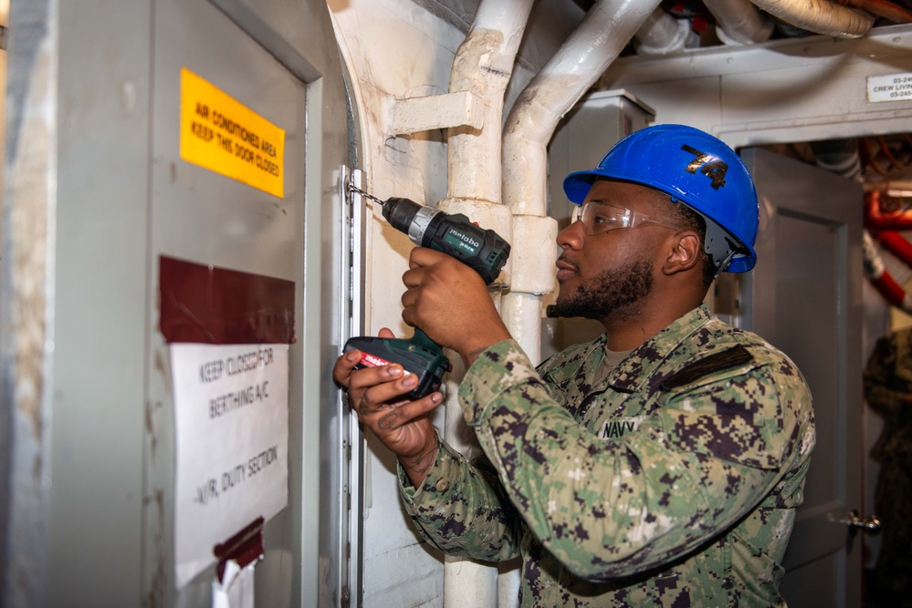 Sailor Performs Maintenance