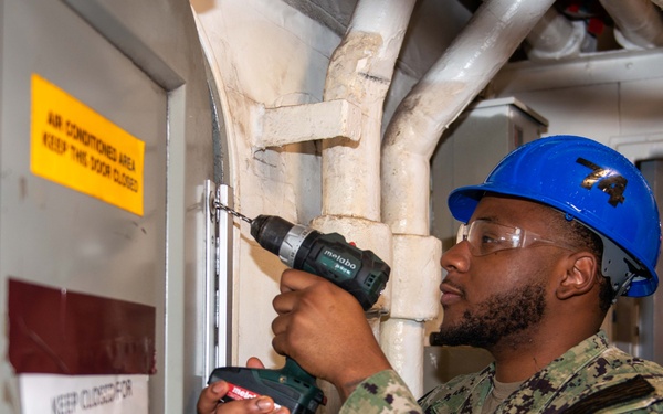 Sailor Performs Maintenance