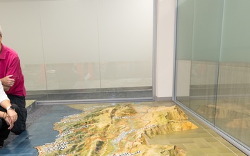 Kristine Brannon and Mark Whitacre Beside 3D Map of Lebanon