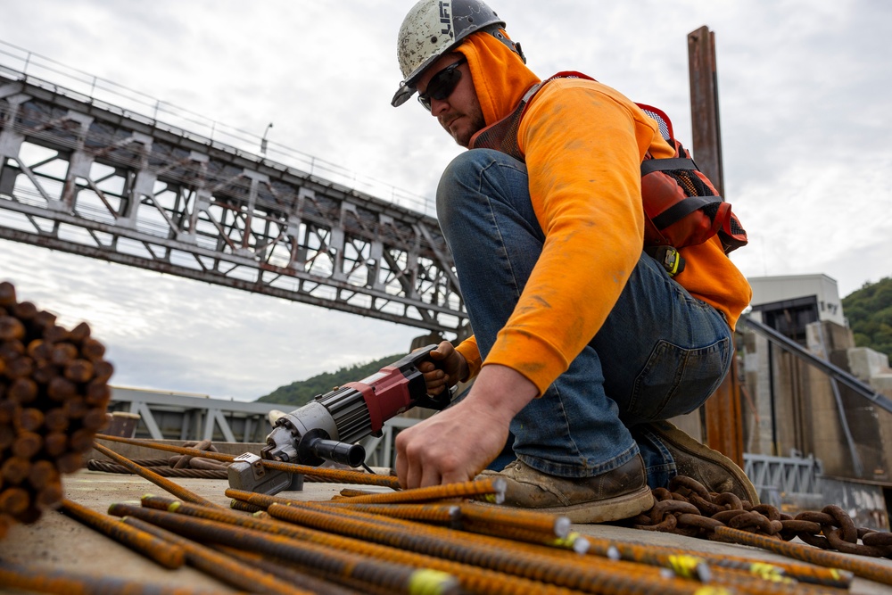 Chipping away old concrete to preserve Montgomery Dam piers for the future