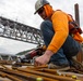 Chipping away old concrete to preserve Montgomery Dam piers for the future