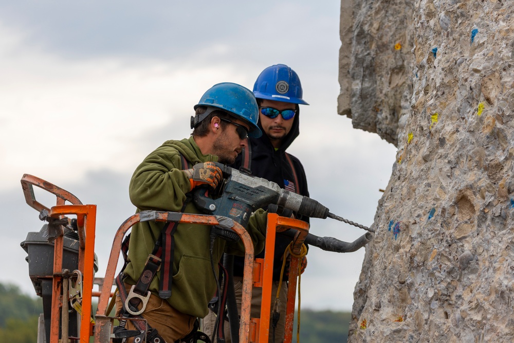 Chipping away old concrete to preserve Montgomery Dam piers for the future