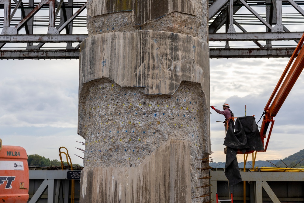 Chipping away old concrete to preserve Montgomery Dam piers for the future