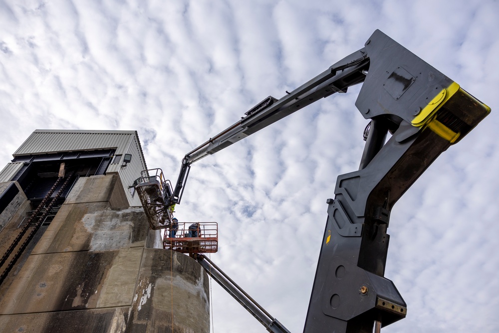 Chipping away old concrete to preserve Montgomery Dam piers for the future