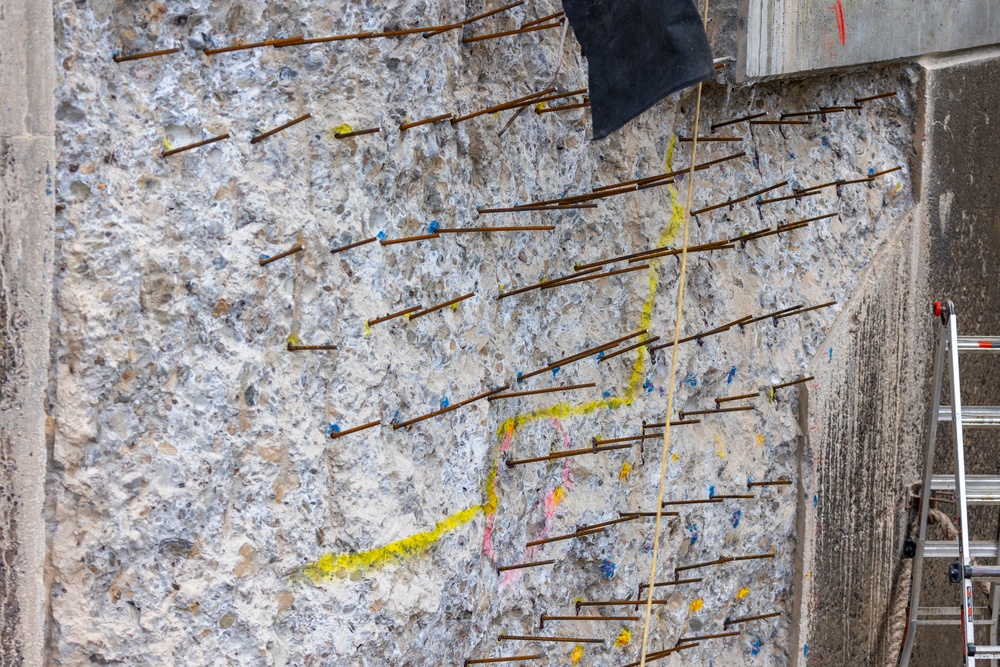 Chipping away old concrete to preserve Montgomery Dam piers for the future