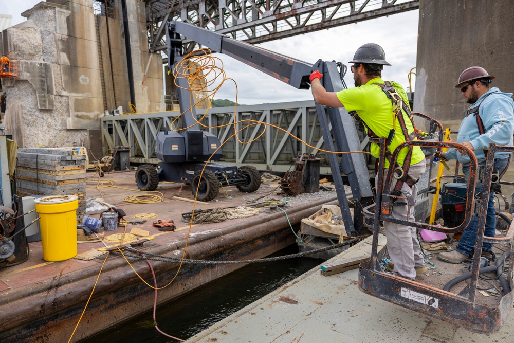 Chipping away old concrete to preserve Montgomery Dam piers for the future