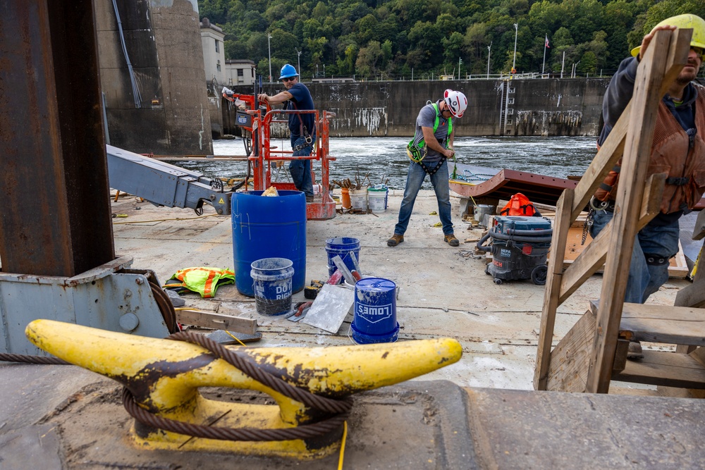 Chipping away old concrete to preserve Montgomery Dam piers for the future