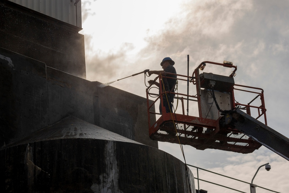 Chipping away old concrete to preserve Montgomery Dam piers for the future