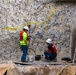 Chipping away old concrete to preserve Montgomery Dam piers for the future