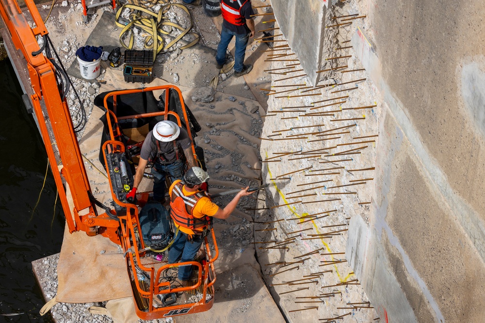 Chipping away old concrete to preserve Montgomery Dam piers for the future