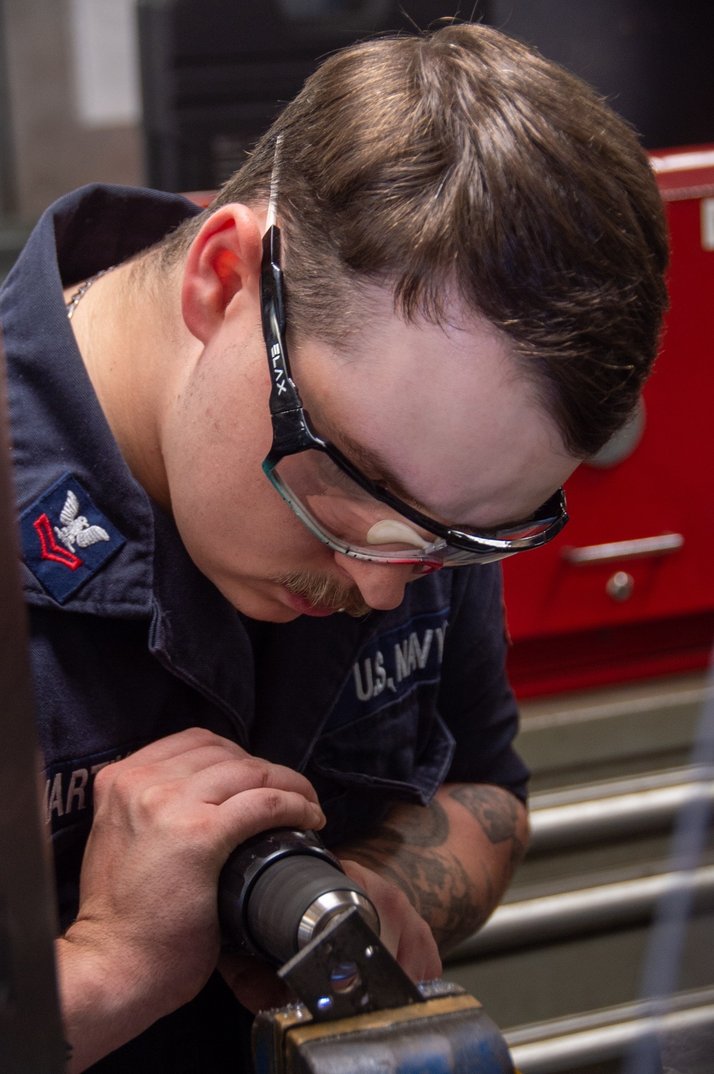 USS Ronald Reagan (CVN 76) Sailors fabricate machine parts