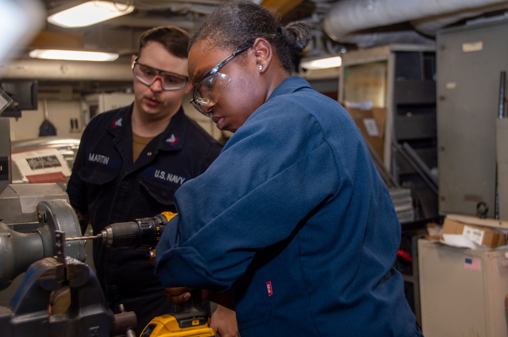 USS Ronald Reagan (CVN 76) Sailors fabricate machine parts