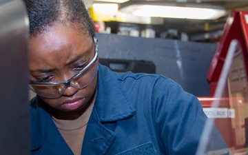 USS Ronald Reagan (CVN 76) Sailors fabricate machine parts