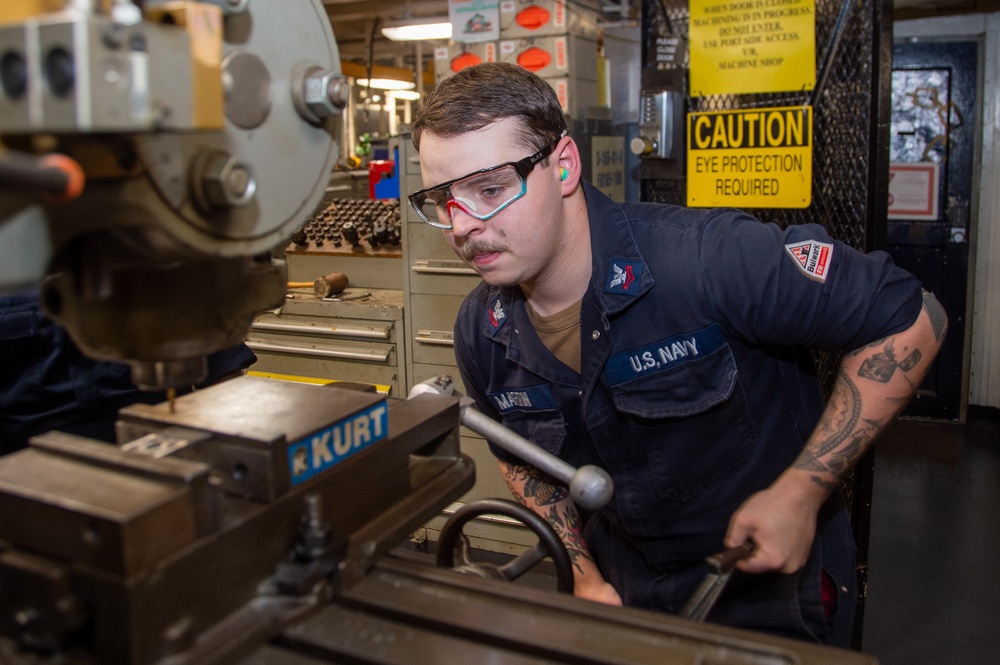 USS Ronald Reagan (CVN 76) Sailors fabricate machine parts