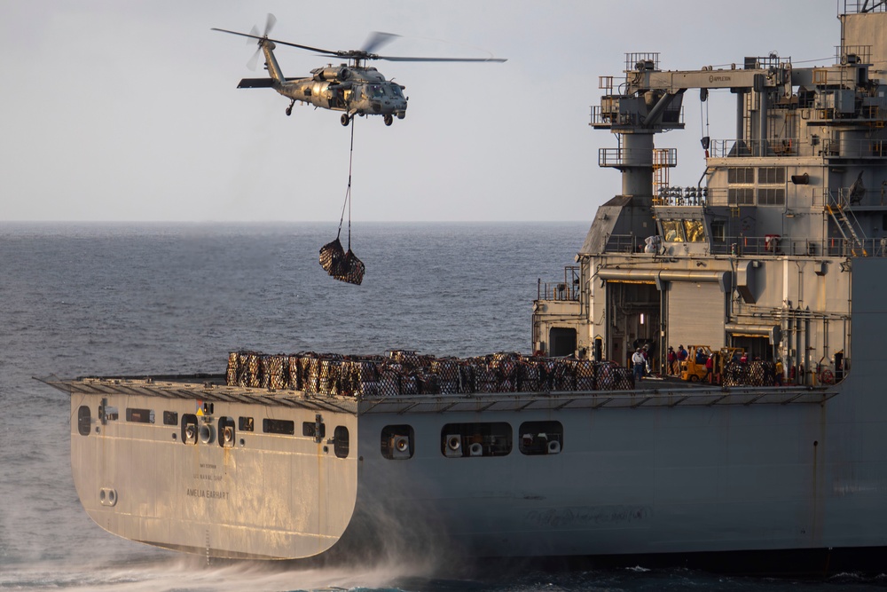 Abraham Lincoln conducts a replenishment-at-sea with Amelia Earhart