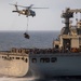 Abraham Lincoln conducts a replenishment-at-sea with Amelia Earhart