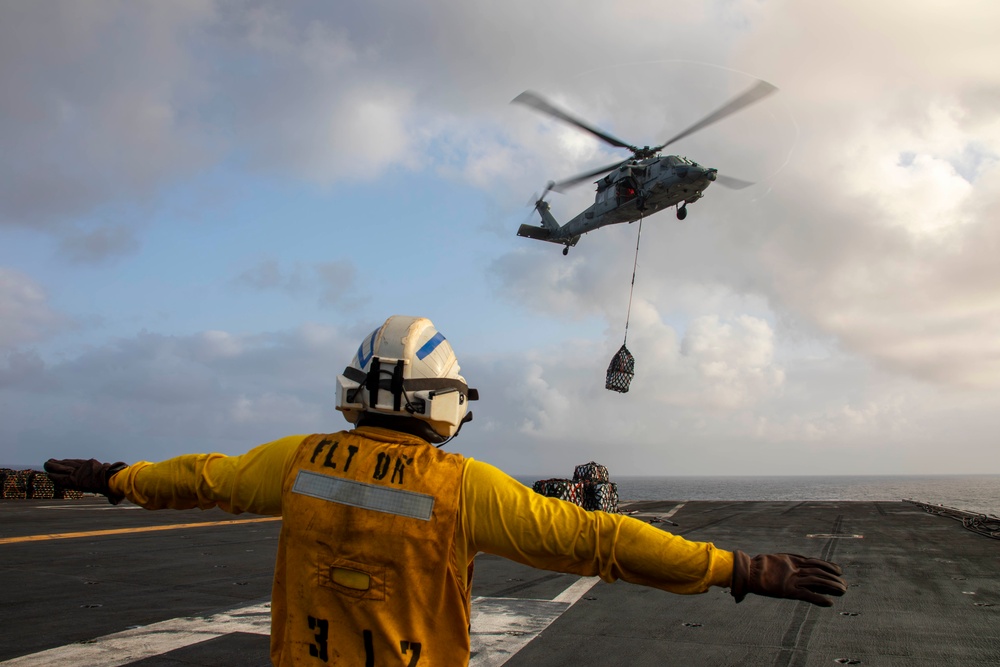 Abraham Lincoln conducts a replenishment-at-sea with Amelia Earhart