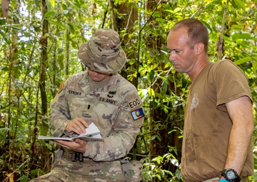 EOD team of joint service members conduct reconnaissance in Munda