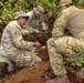 EOD team of joint service members conduct reconnaissance in Munda