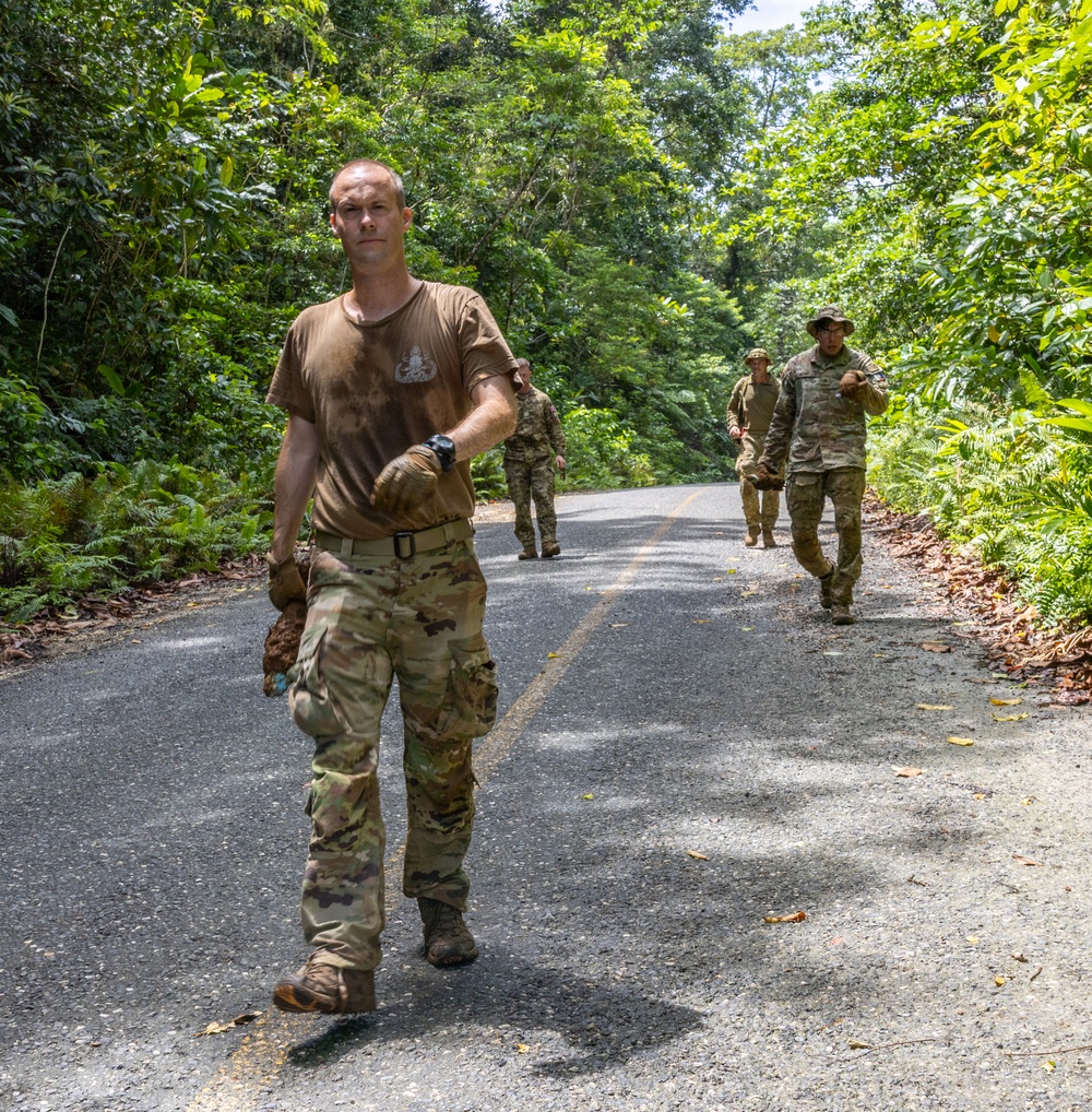 EOD team of joint service members conduct reconnaissance in Munda