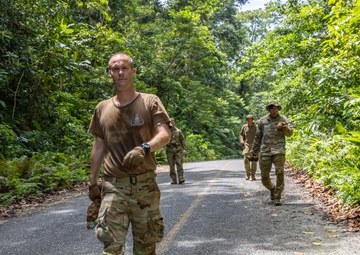EOD team of joint service members conduct reconnaissance in Munda