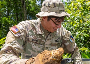 EOD team of joint service members conduct reconnaissance in Munda
