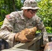 EOD team of joint service members conduct reconnaissance in Munda