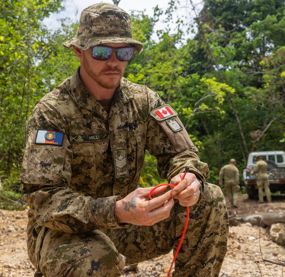 Joint multinational service members conduct demolition during operation Render Safe