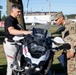 Motorcycle Mentor Inspects Bike with Rider