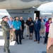 Public religious leaders are briefed by a Kirtland Airman before touring a MC-130J