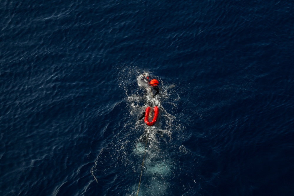 Sailors aboard the USS Howard conduct a small boat operation in the South China Sea