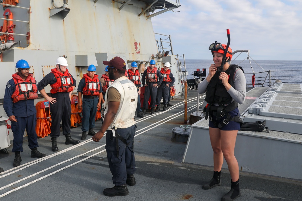 Sailors aboard the USS Howard conduct a small boat operation in the South China Sea