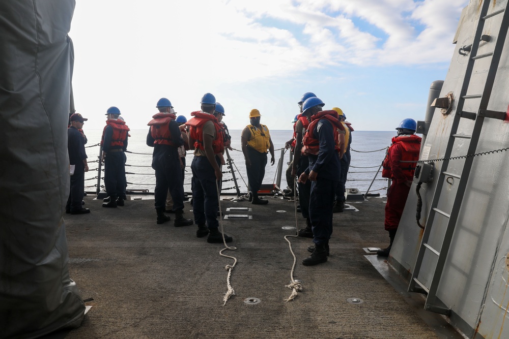 Sailors aboard the USS Howard conduct a small boat operation in the South China Sea