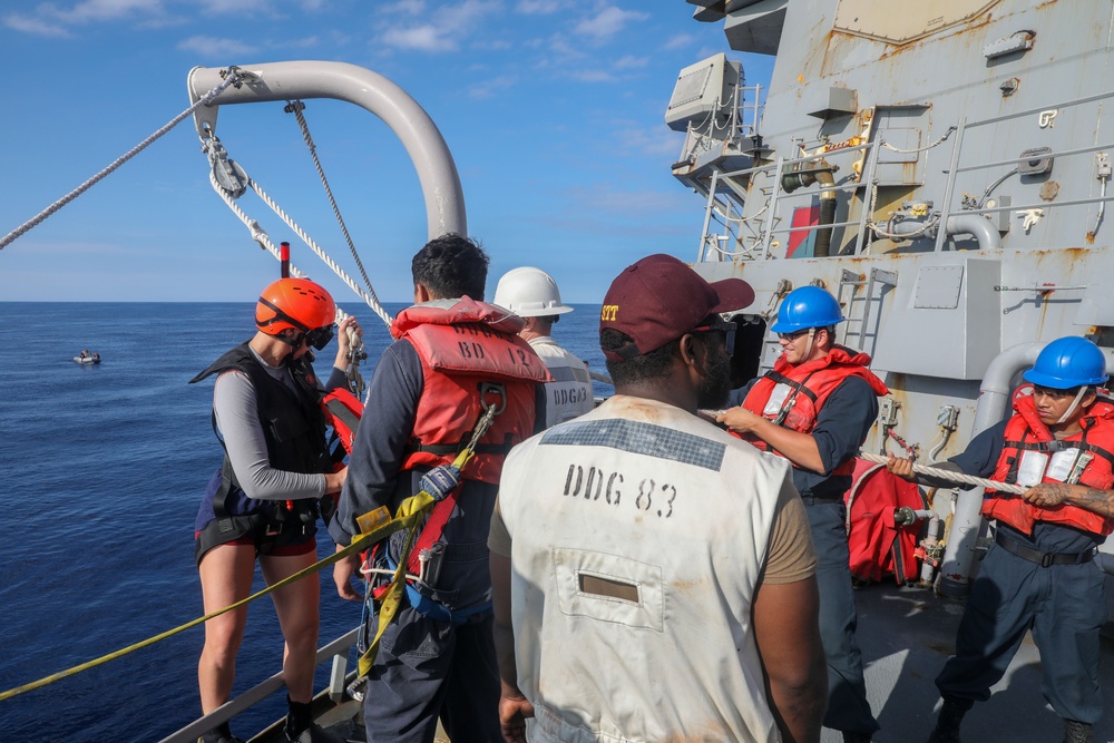 Sailors aboard the USS Howard conduct a small boat operation in the South China Sea