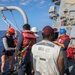 Sailors aboard the USS Howard conduct a small boat operation in the South China Sea