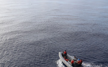 Sailors aboard the USS Howard conduct a small boat operation in the South China Sea