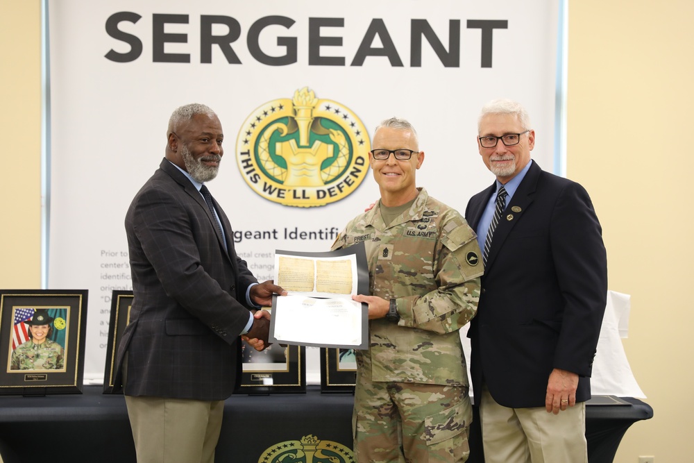 Command Sgt. Maj. Robert Priest, 3rd Medical Command (Deployment Support), is awarded his induction into the U.S. Army Drill Sergeant Academy Hall of Fame Award