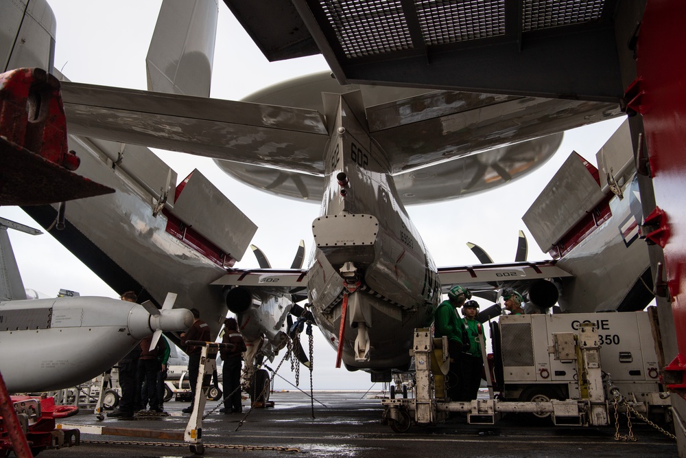 Nimitz Sailors Conduct Maintenance on a Hawkeye