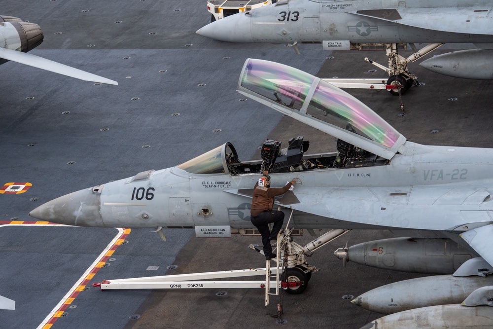 Nimitz Sailor Climbs Down From Super Hornet