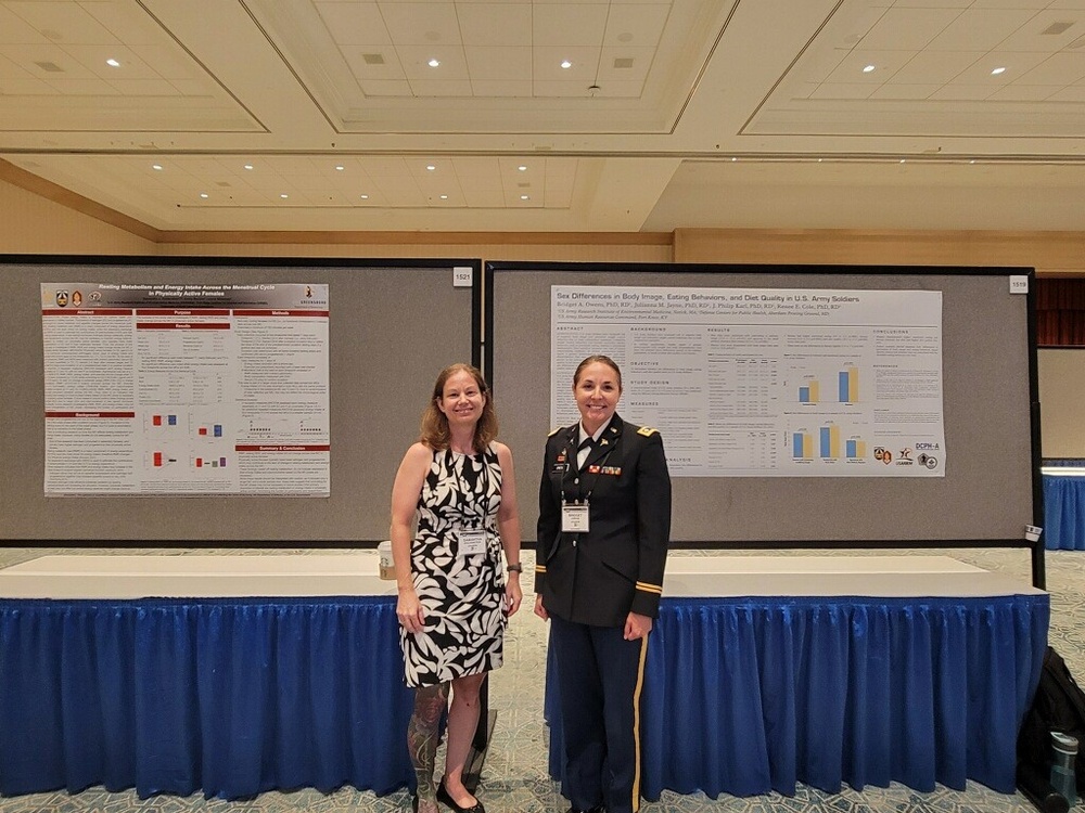 Lt. Col. Bridget Owens and Samantha Goldenstein present posters at MHSRS 2024