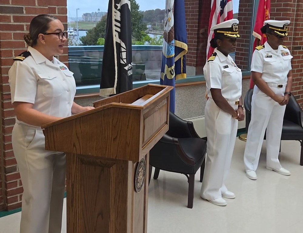 Chaplain Regina Johnson leads prayer