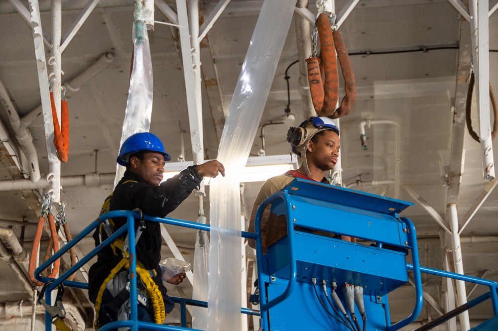 USS Ronald Reagan (CVN 76) Sailors prepare for a counter-measure washdown