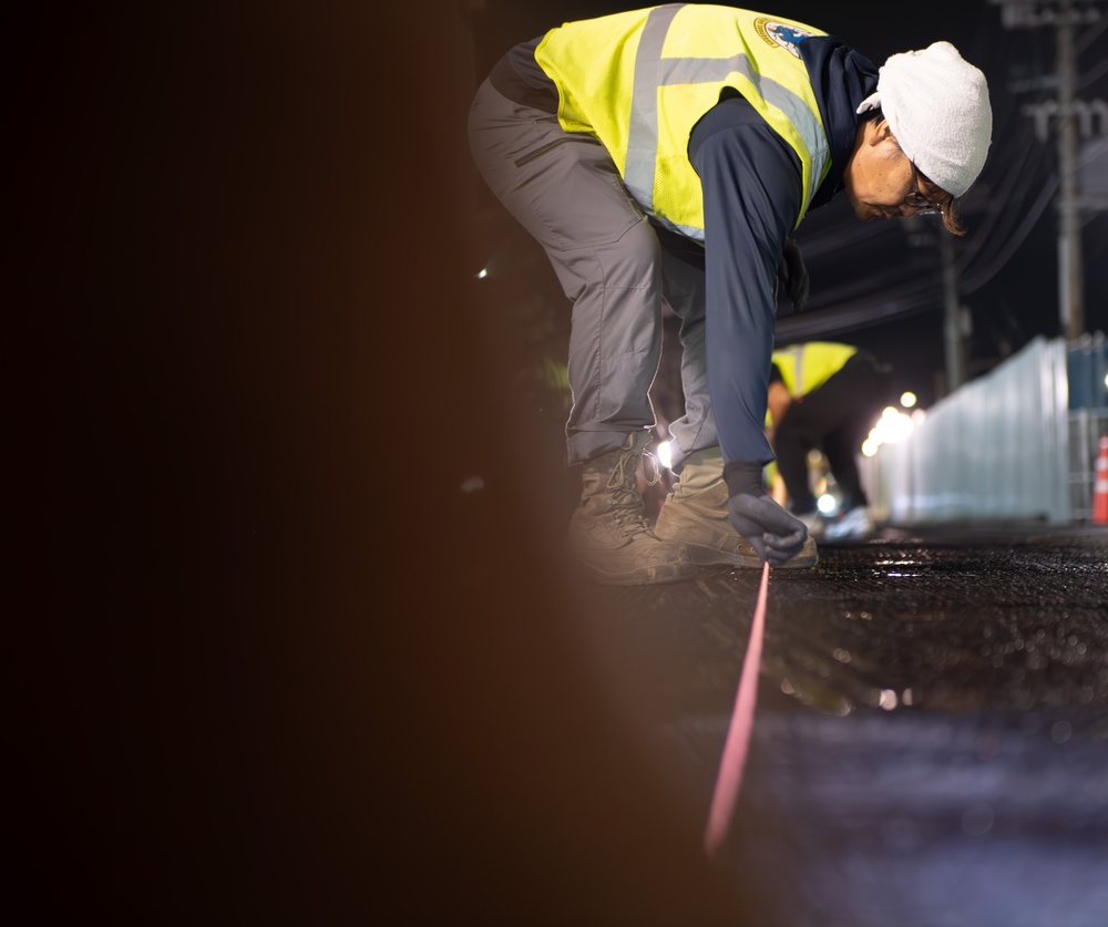 Paving the way: 374 CES makes nighttime road repairs