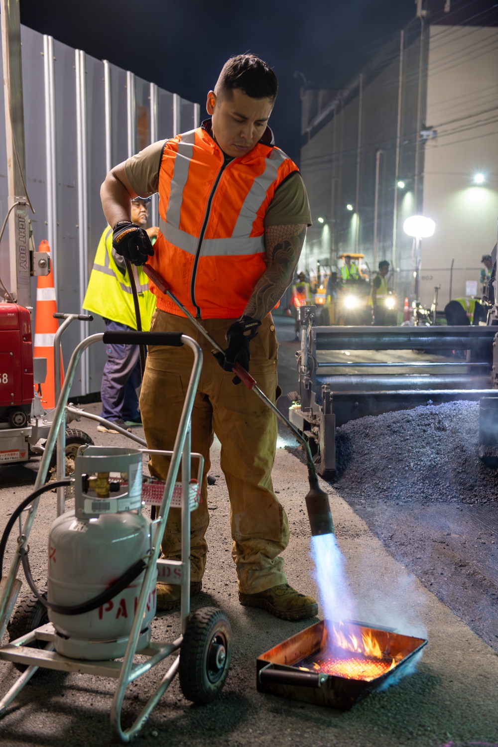 Paving the way: 374 CES makes nighttime road repairs