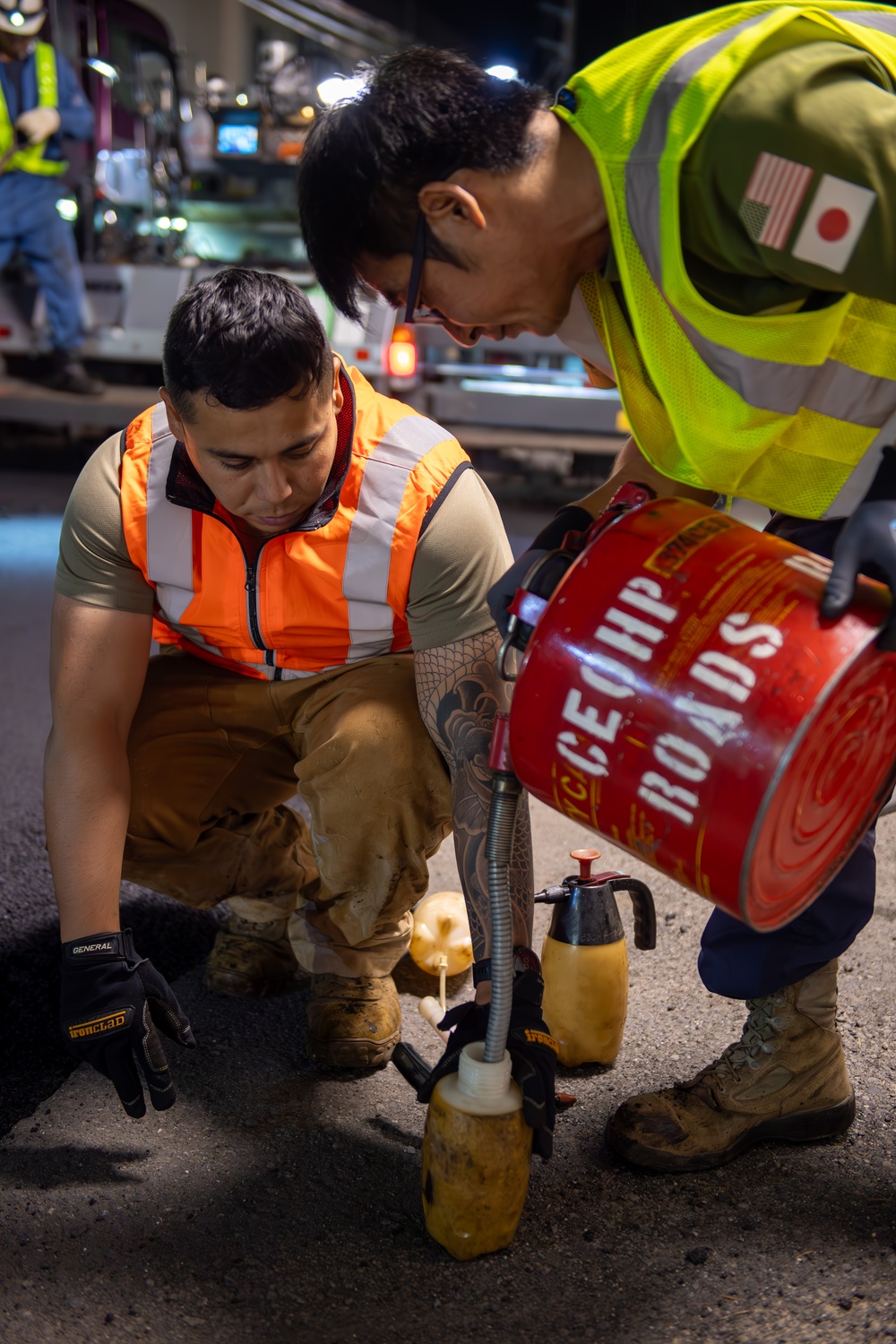Paving the way: 374 CES makes nighttime road repairs