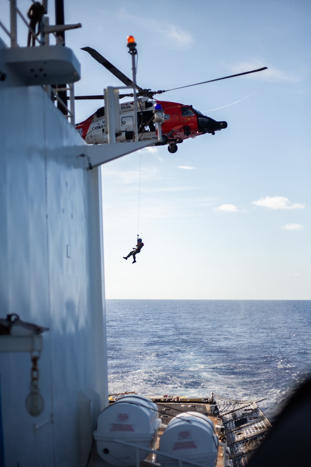 Coast Guard Cutter Bear, MH-60 Jayhawk helicopter aircrew conduct hoisting operations