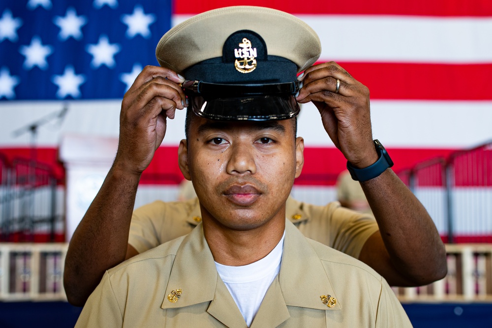 Sailors aboard USSGW conduct a chief pinning ceremony.