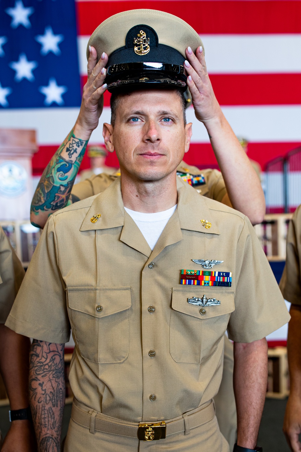 Sailors aboard USSGW conduct a chief pinning ceremony.