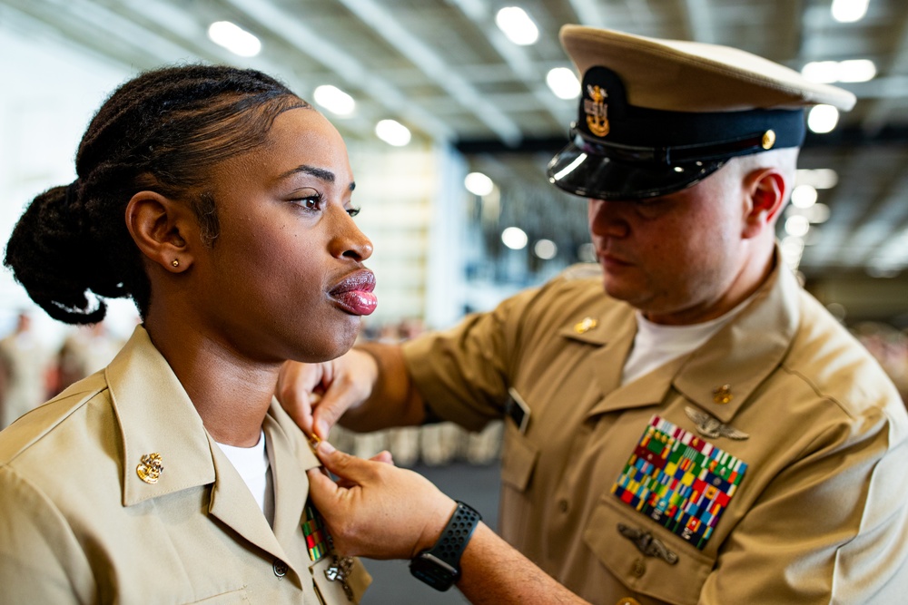 Sailors aboard USSGW conduct a chief pinning ceremony.