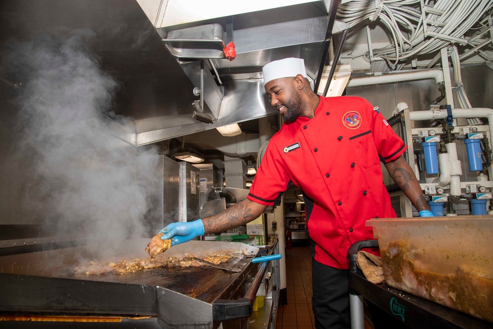 USS Carl Vinson Sailor Prepares Food in the Galley